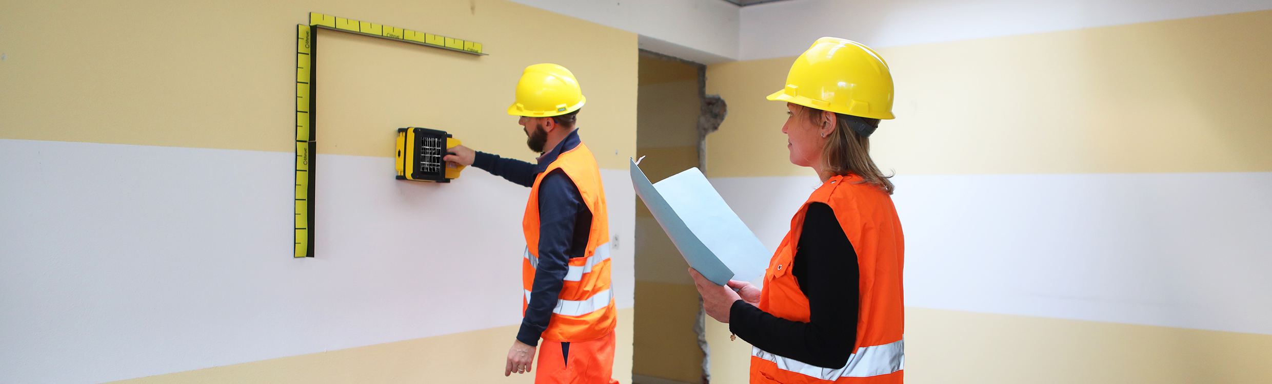 2 surveyors using a ferro scanning and rebar detection device