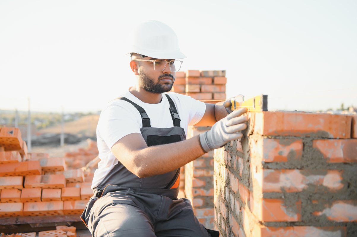 surveyor setting out for brickwork